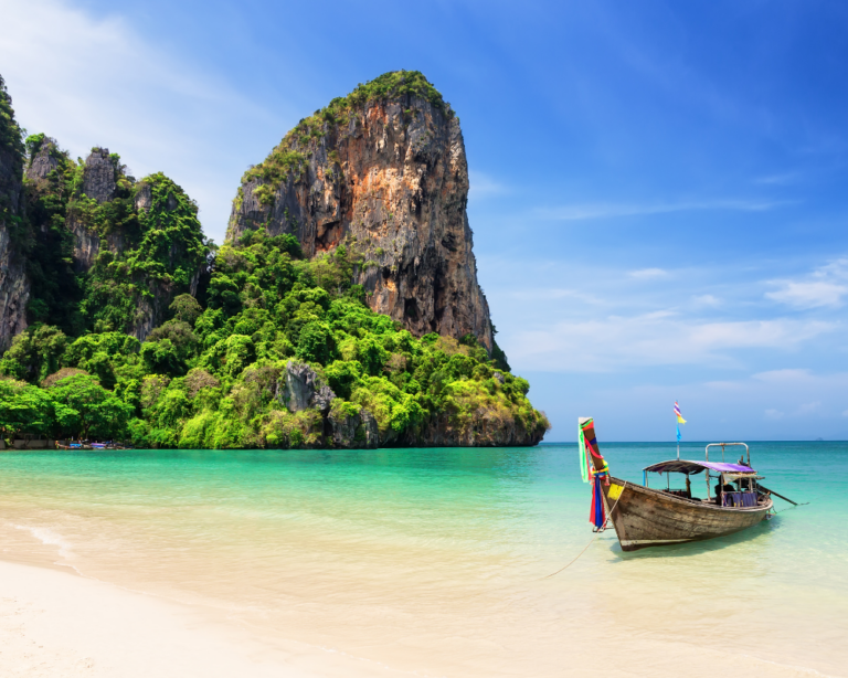 long-tail boat by the beach of phi phi islands
